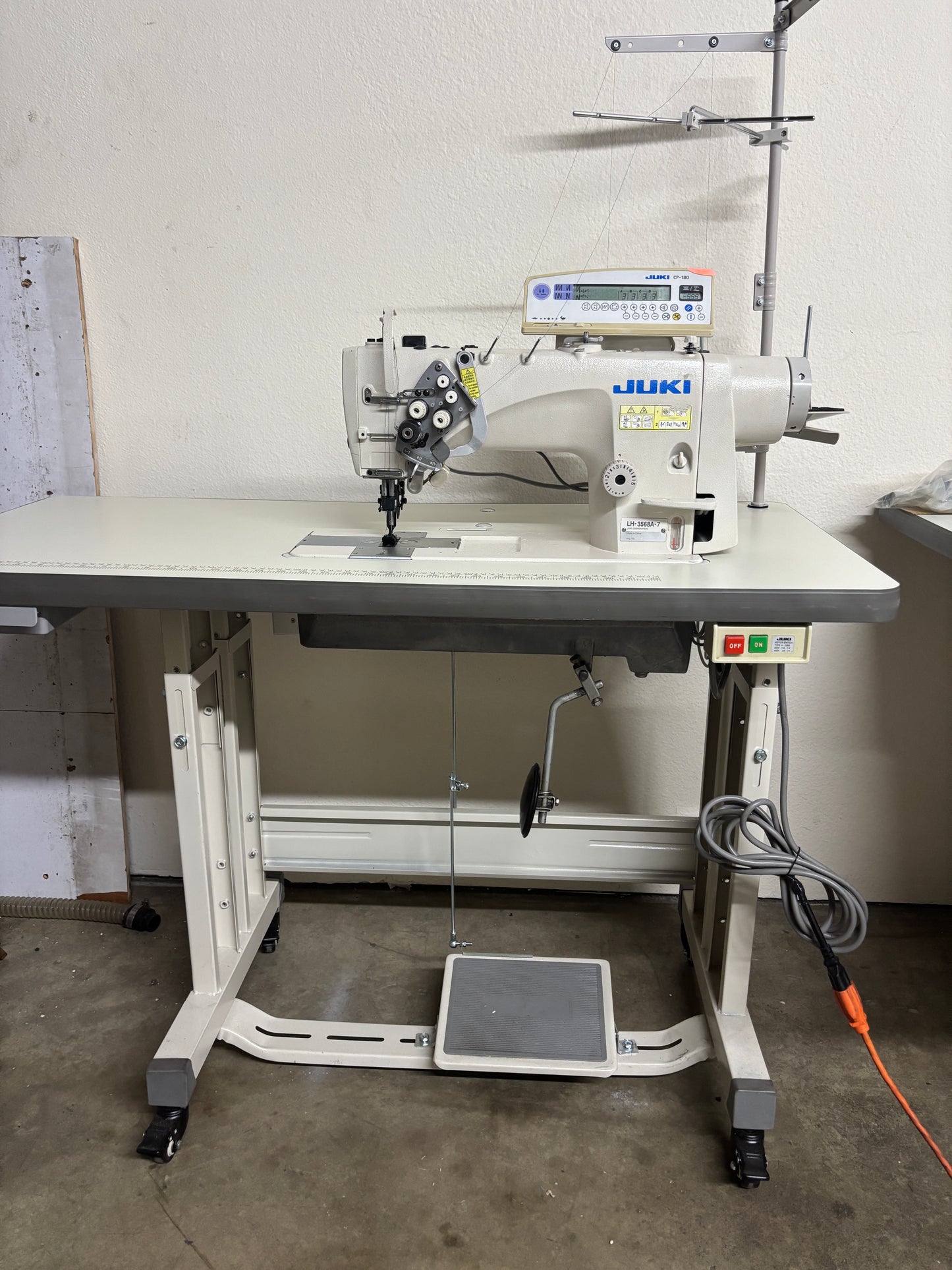 Pre-owned JUKI LH3568A-7 automatic double needle split bar sewing machine