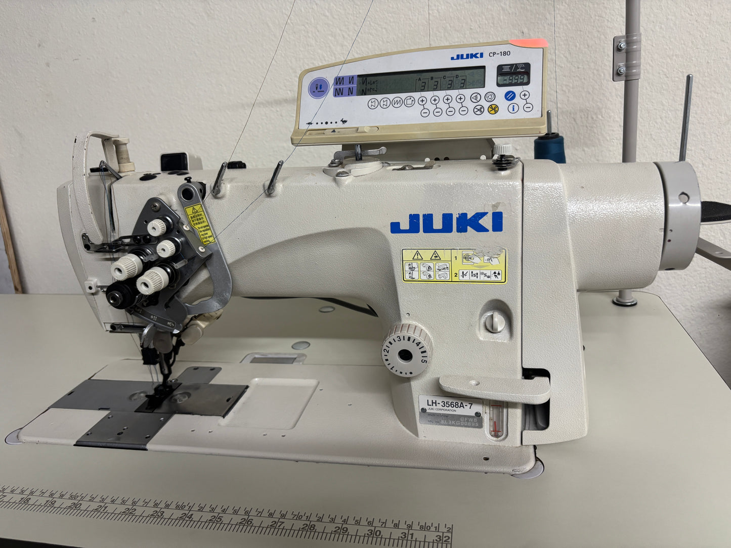 Pre-owned JUKI LH3568A-7 automatic double needle split bar sewing machine