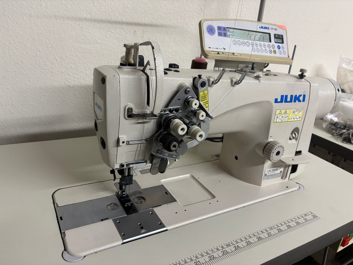 Pre-owned JUKI LH3568A-7 automatic double needle split bar sewing machine