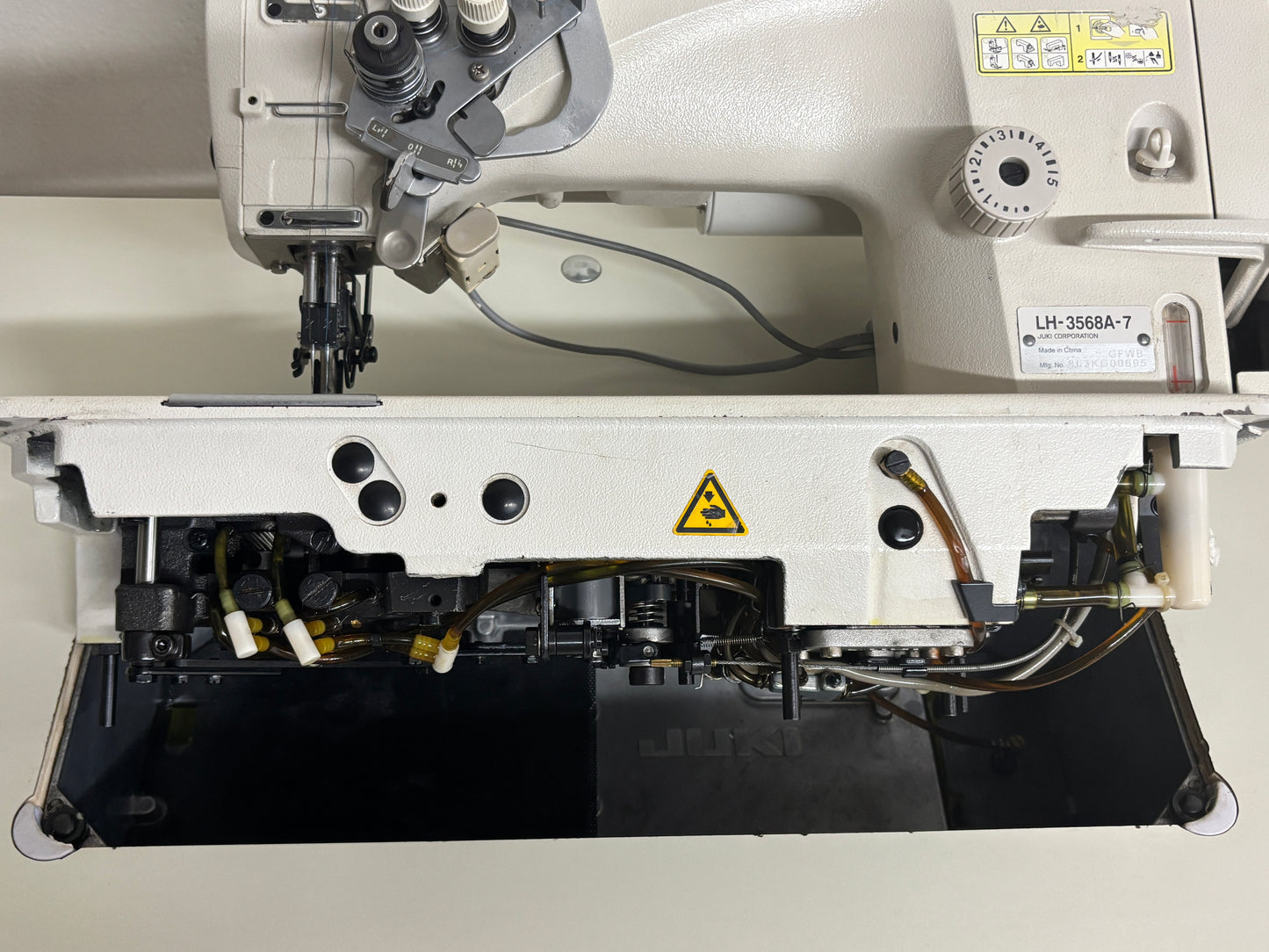 Pre-owned JUKI LH3568A-7 automatic double needle split bar sewing machine