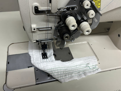 Pre-owned JUKI LH3568A-7 automatic double needle split bar sewing machine